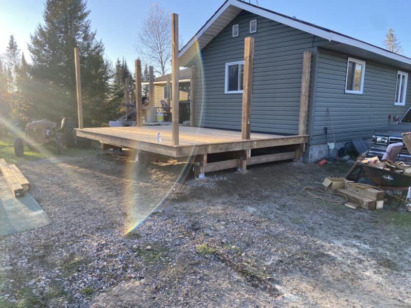 Completed raised deck at golden hour in rural Northern Ontario.