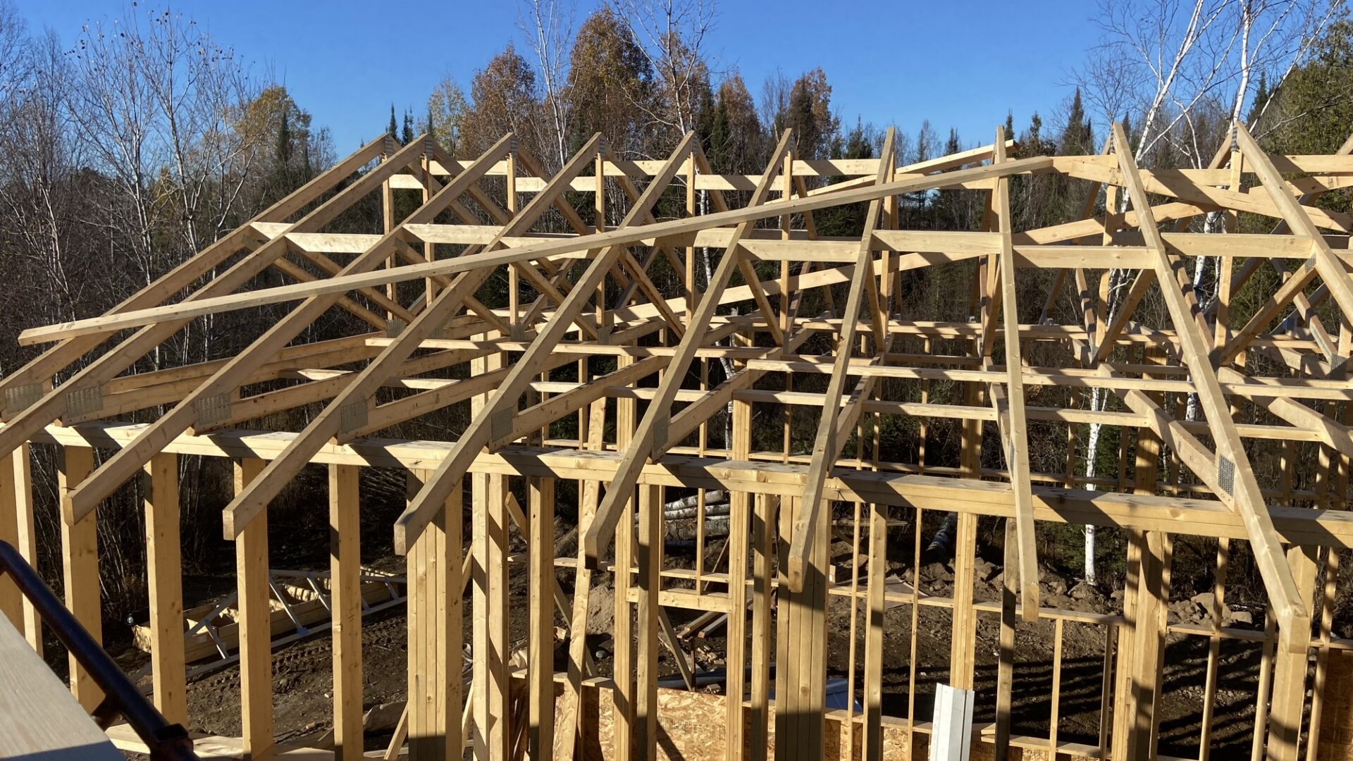 Roof trusses installed on a two-storey garage.